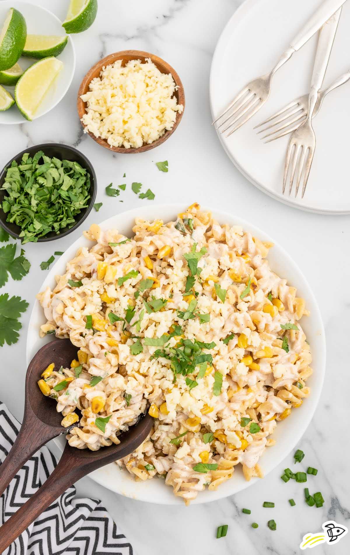 a bowl of Mexican Street Corn Pasta Salad garnished with cilantro