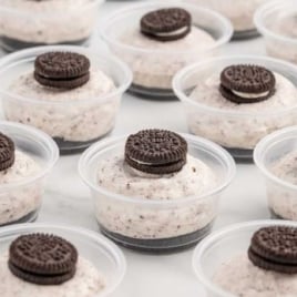 cups of Oreo Desserts topped with mini oreos