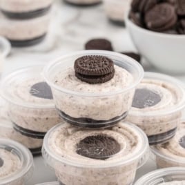 cups of Oreo Desserts topped with mini oreos