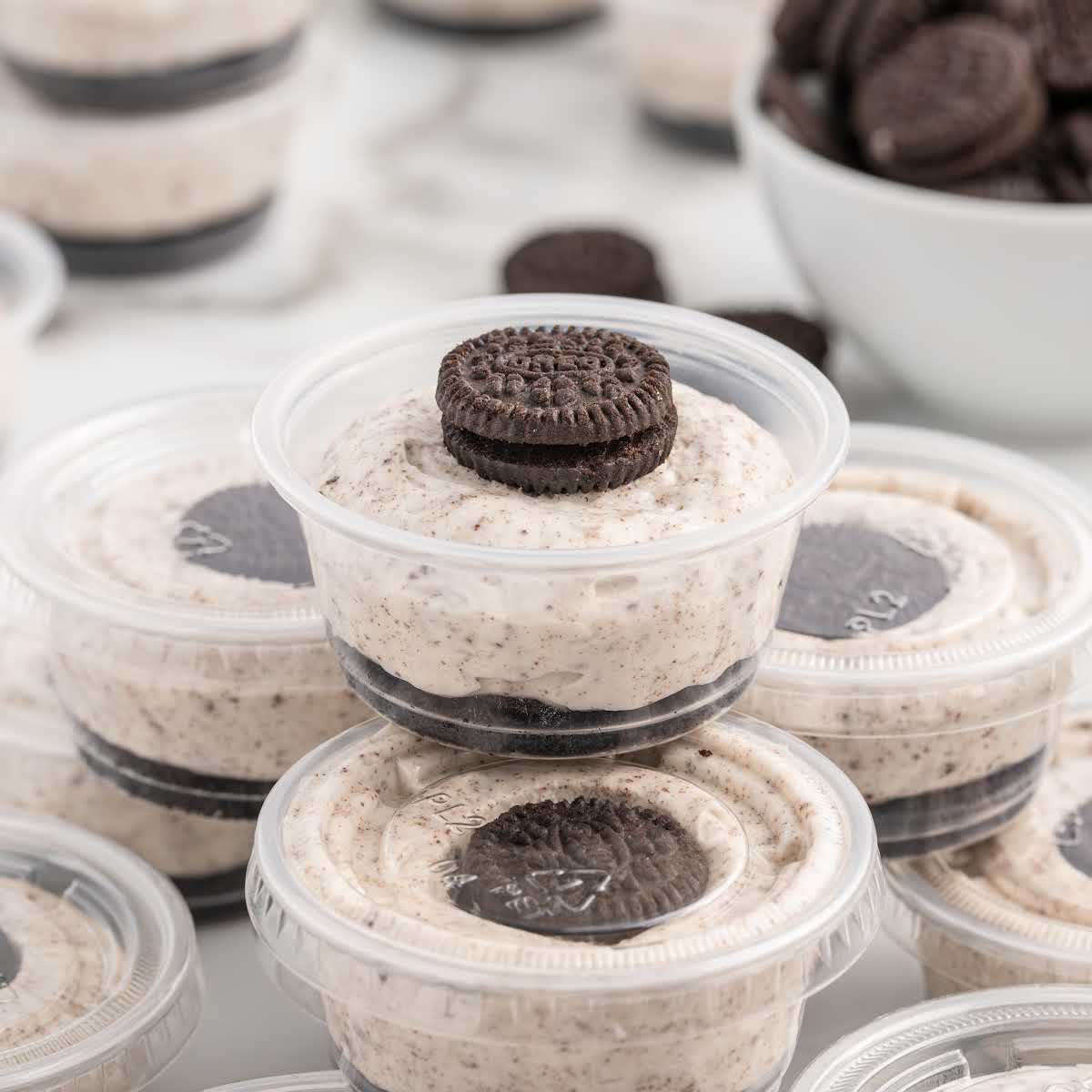cups of Oreo Desserts topped with mini oreos