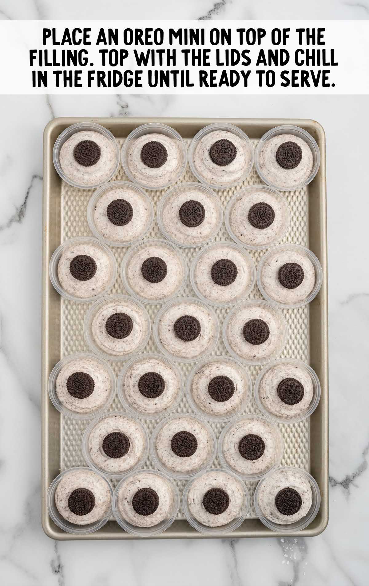 Oreo mini cookies placed on top of the cookies and cream filling