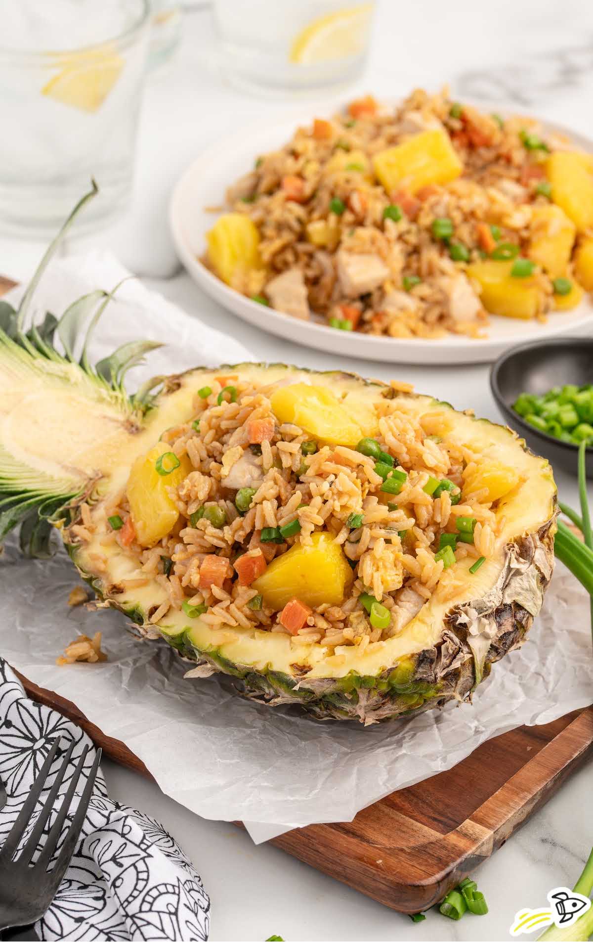 close up shot of Pineapple Chicken Fried Rice in a pineapple