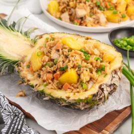 close up shot of Pineapple Chicken Fried Rice in a pineapple