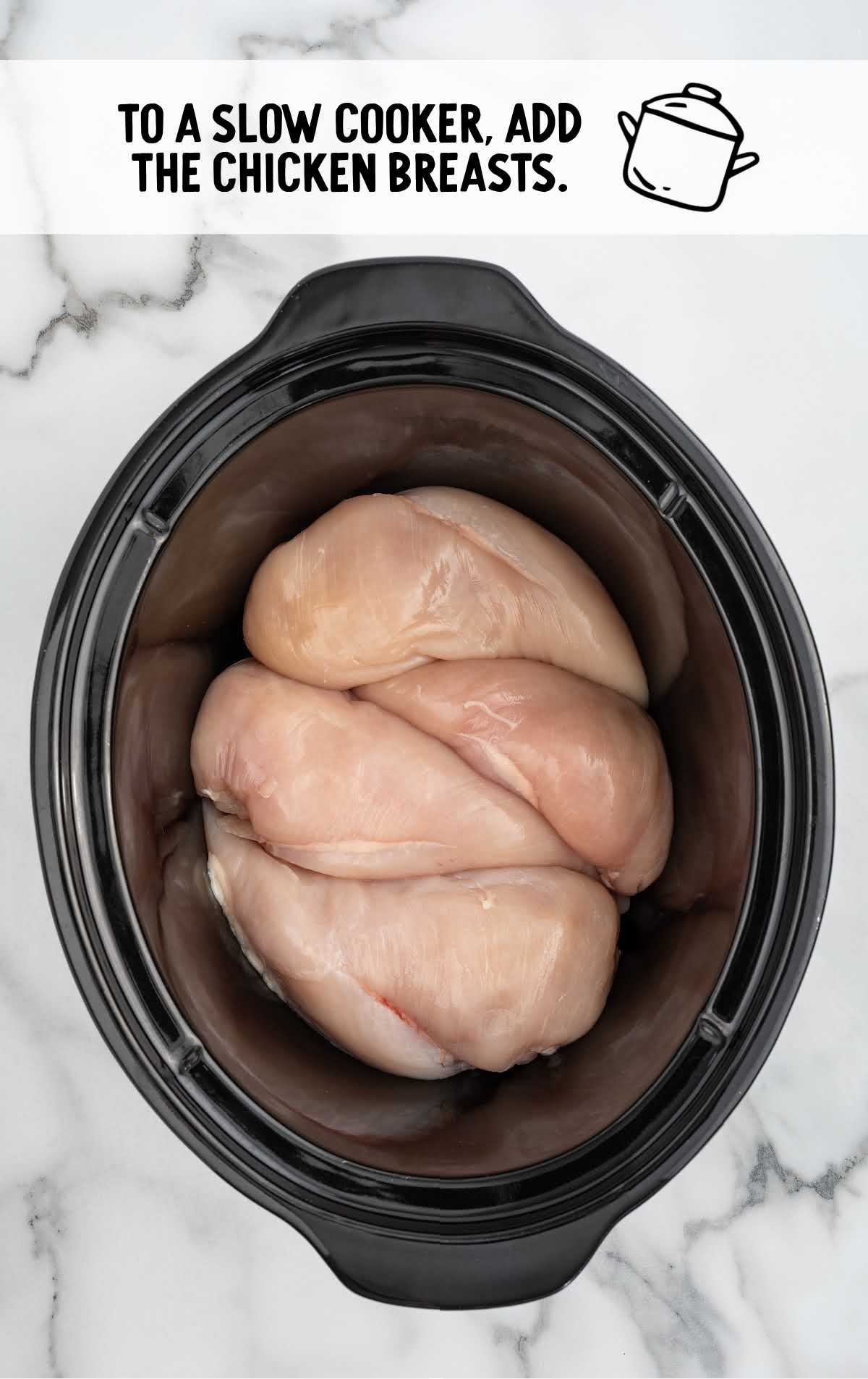 boneless skinless chicken breasts added to the crockpot 