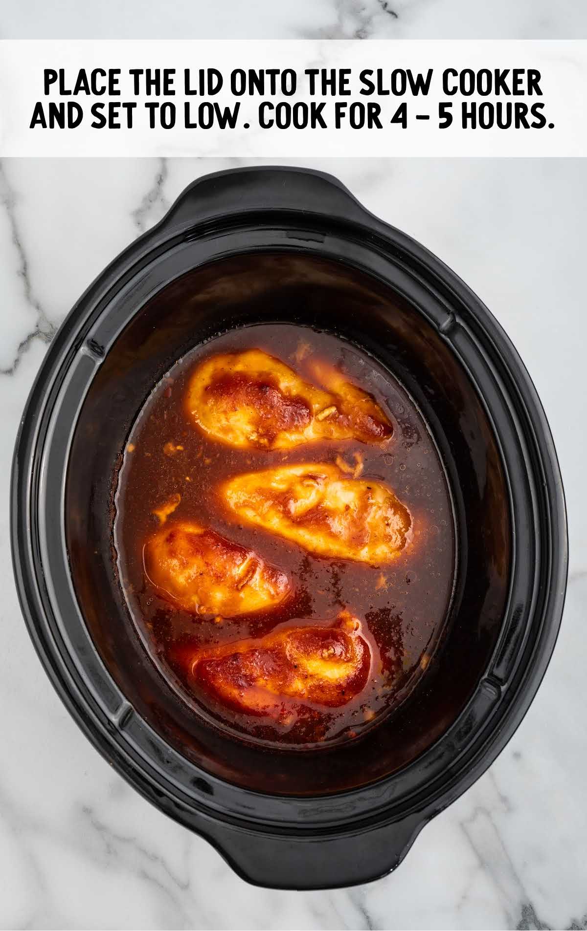 chicken being cooked in the crockpot
