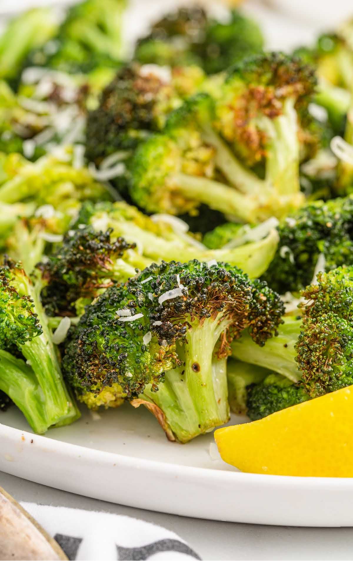 close up shot of pieces of broccolis on a plate