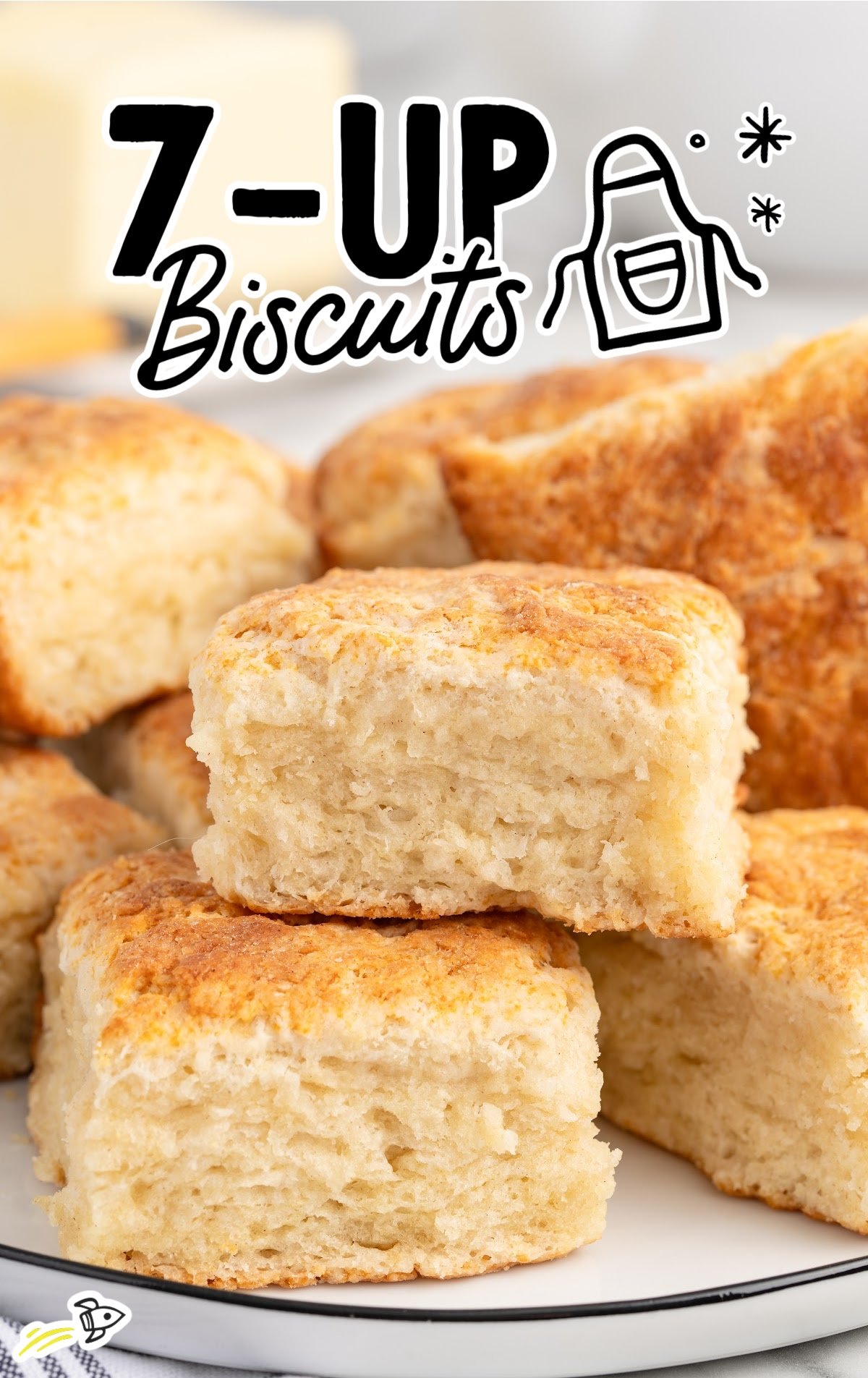 A pile of 7up biscuits are stacked on a plate.