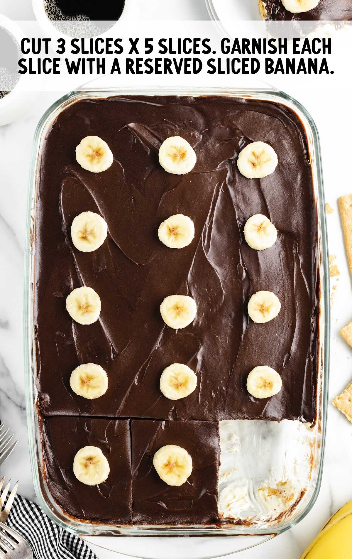 cake sliced and topped with slices of bananas