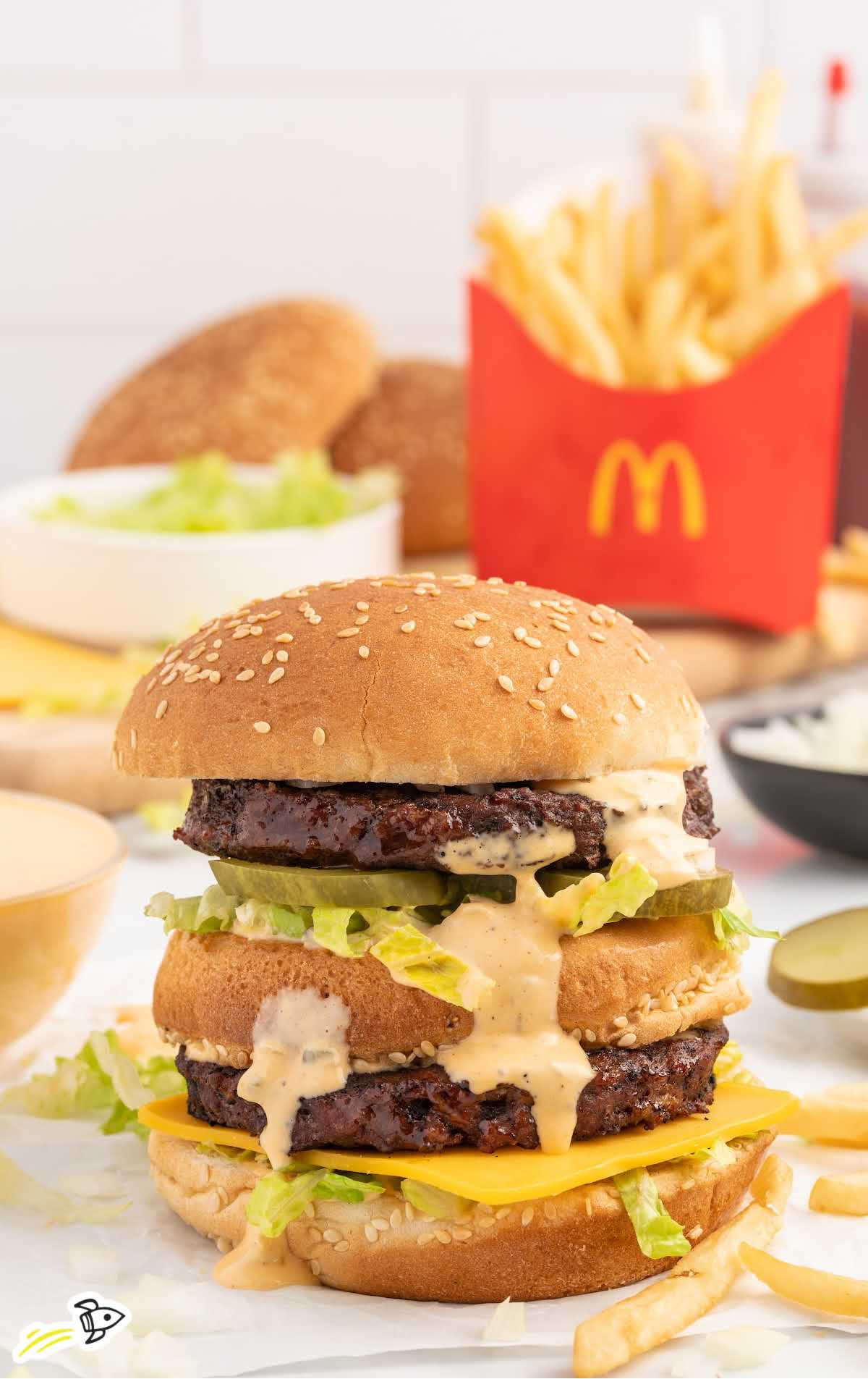 a burger with Big Mac Sauce and a side of fries