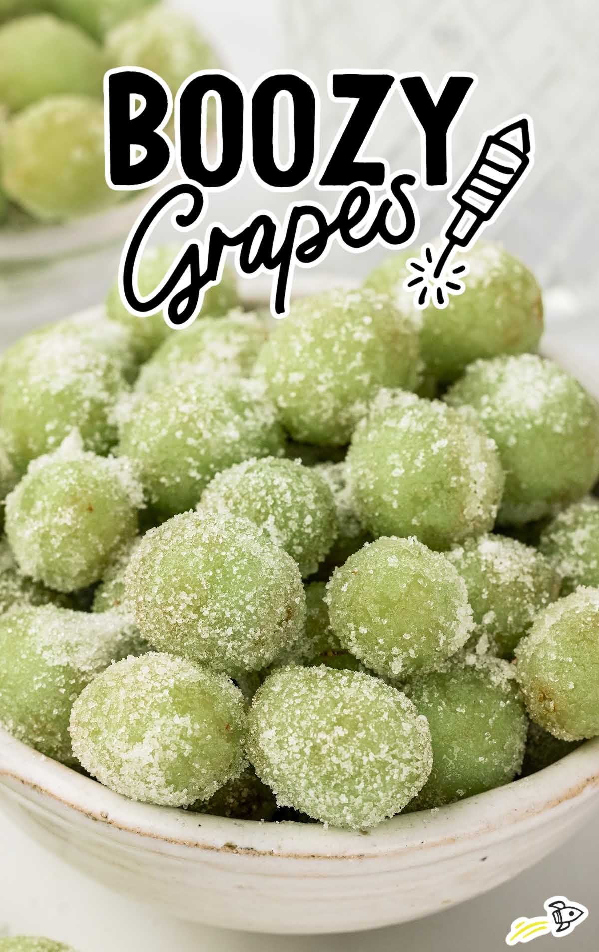 a bowl of grapes coated in sugar