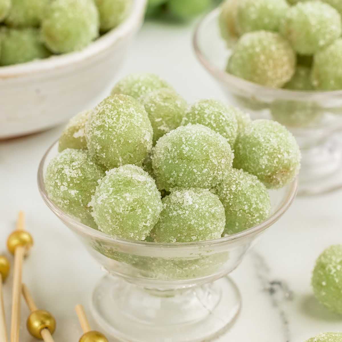 a cup of grapes coated in sugar