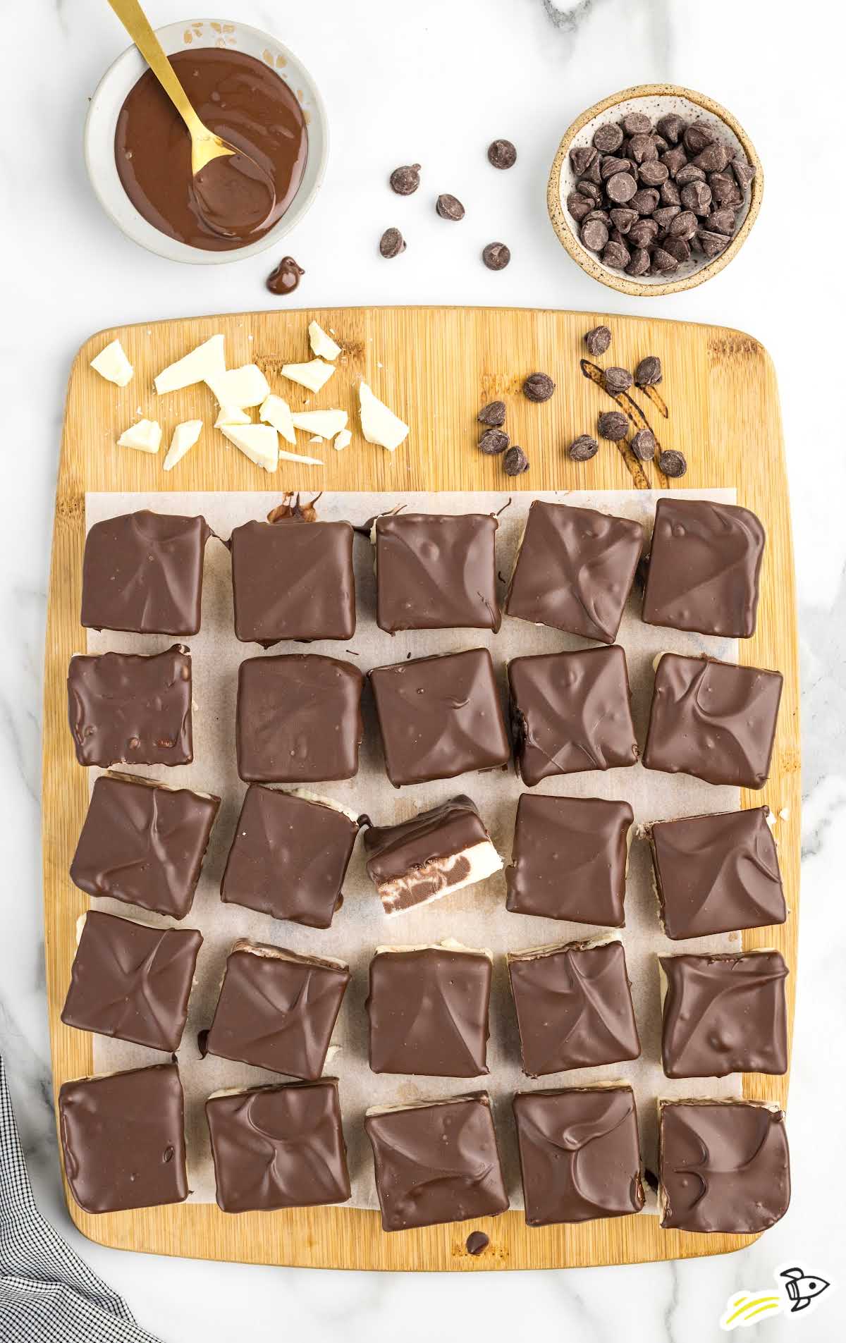 a bunch of Boston Cream Fudge on a wooden board