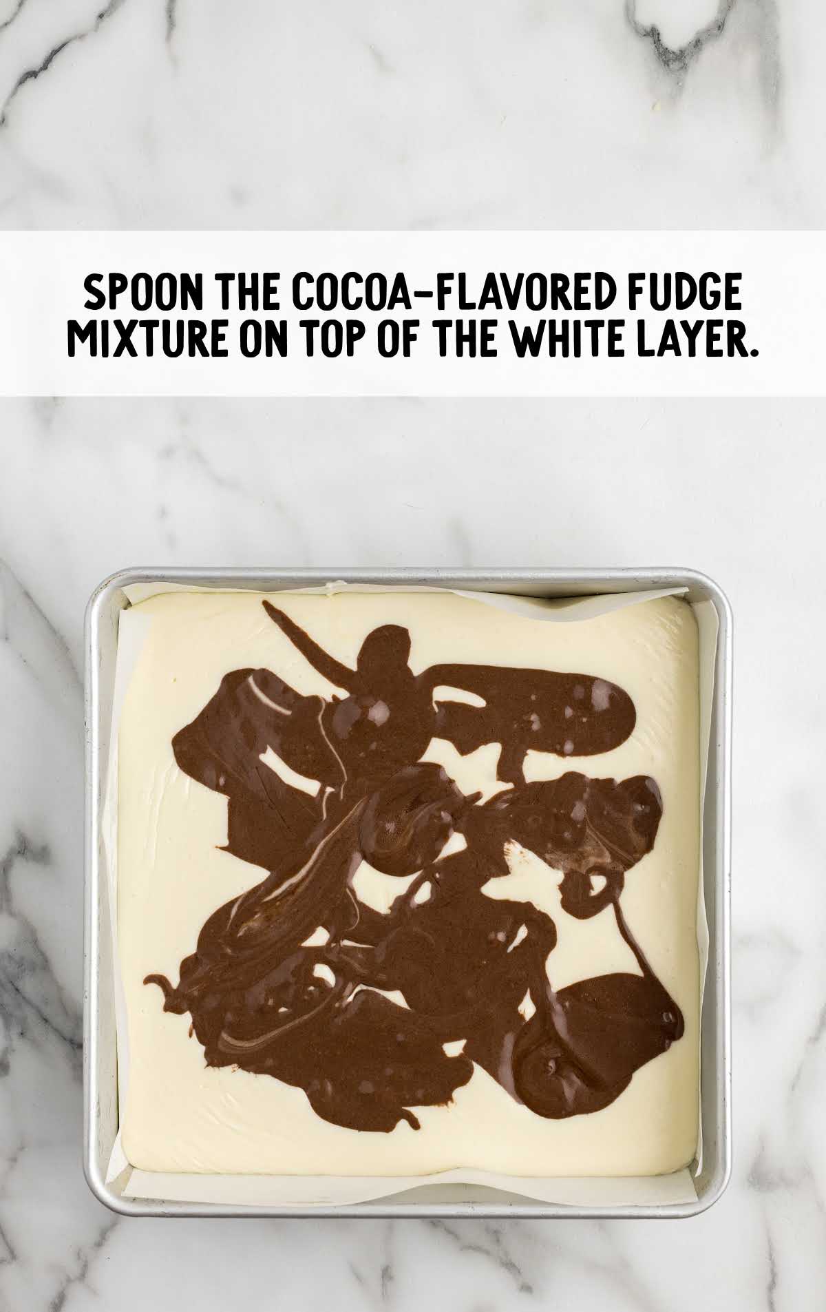 cocoa-flavored fudge mixture spooned on top of the white fudge layer 