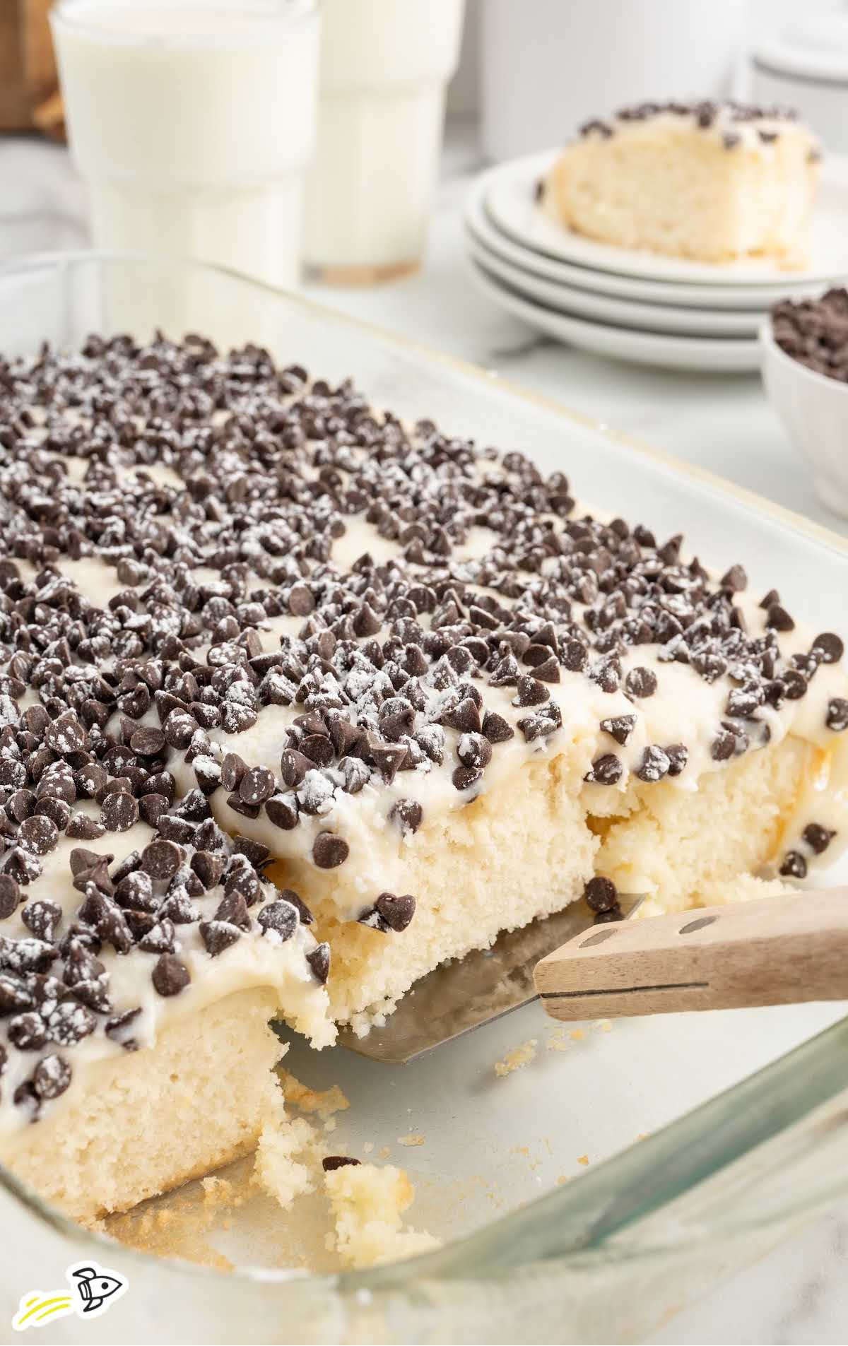 a baking dish of Cannoli Poke Cake