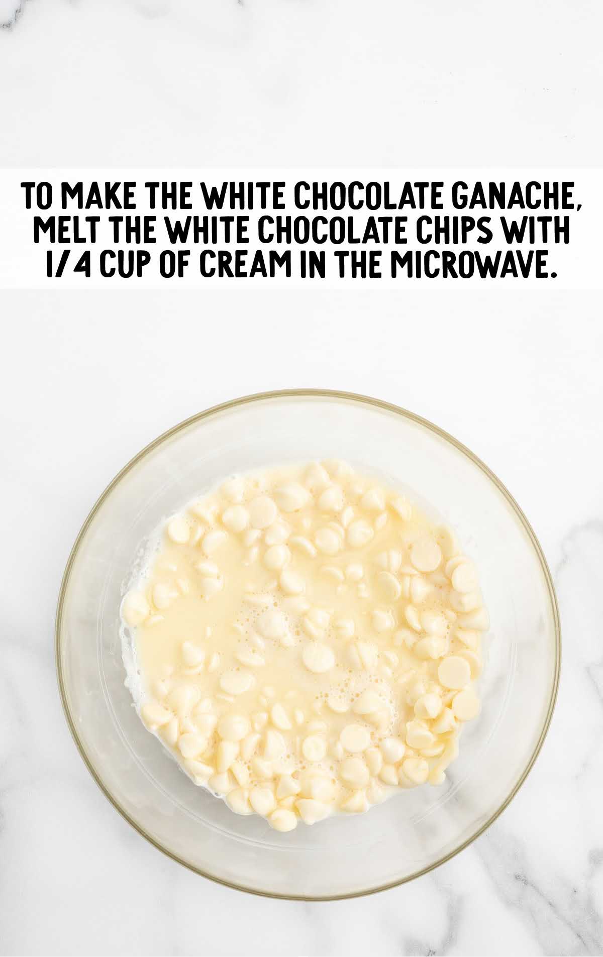 white chocolate chips and cream combined in a bowl