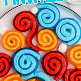 a bunch of Jello Pinwheels with mini marshmallows on a plate