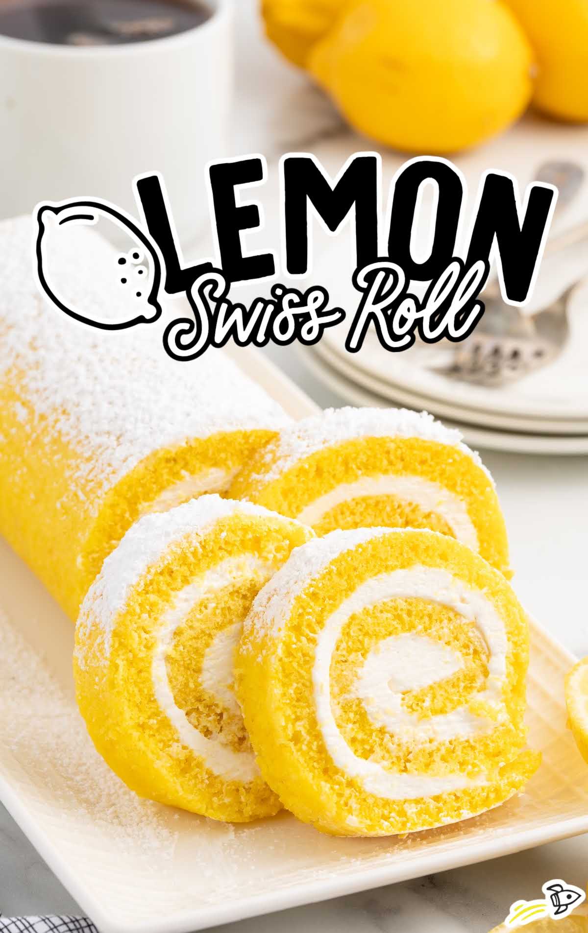 slices of Lemon Swiss Roll sprinkled with powdered sugar on a plate