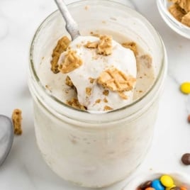a Mason Jar of Ice Cream topped with crushed cookies