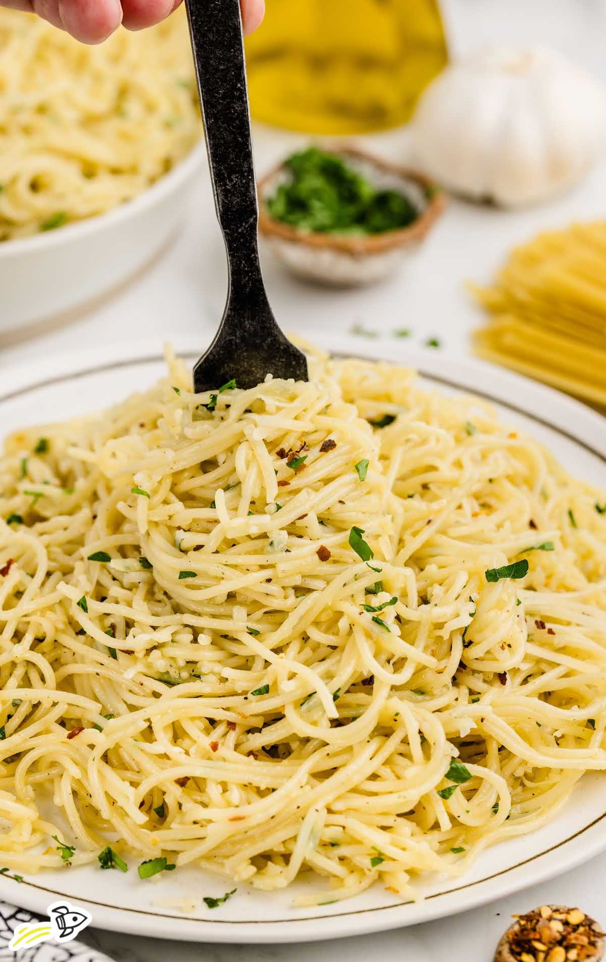 a plate of Parmesan Noodles garnished with parsley