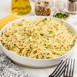 a bowl of Parmesan Noodles garnished with parsley