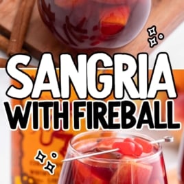 a glass of Sangria garnished with sliced fruit and cinnamon candies