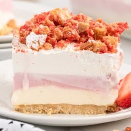 a slice of Strawberry Shortcake Ice Cream Cake on a plate