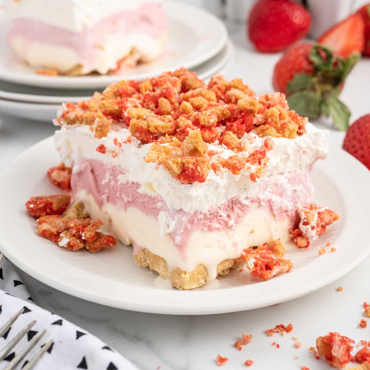 a slice of Strawberry Shortcake Ice Cream Cake on a plate