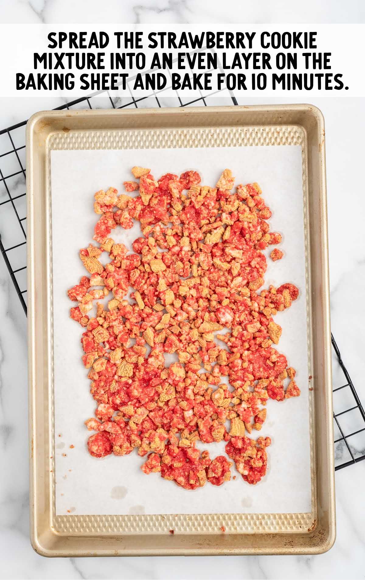 strawberry cookie mixture spread on a baking sheet