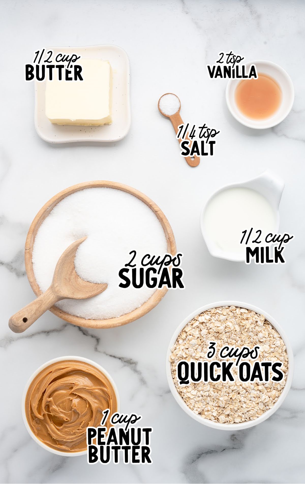 Overhead view of all measured ingredients for no-bake peanut butter cookies, including peanut butter, quick oats, sugar, butter, milk, salt, and vanilla, labeled with bold text.