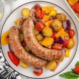a plate of Italian Sausage with potatoes, bell peppers, onions, and tomatoes