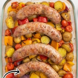 a baking dish of Italian Sausage with potatoes, bell peppers, onions, and tomatoes