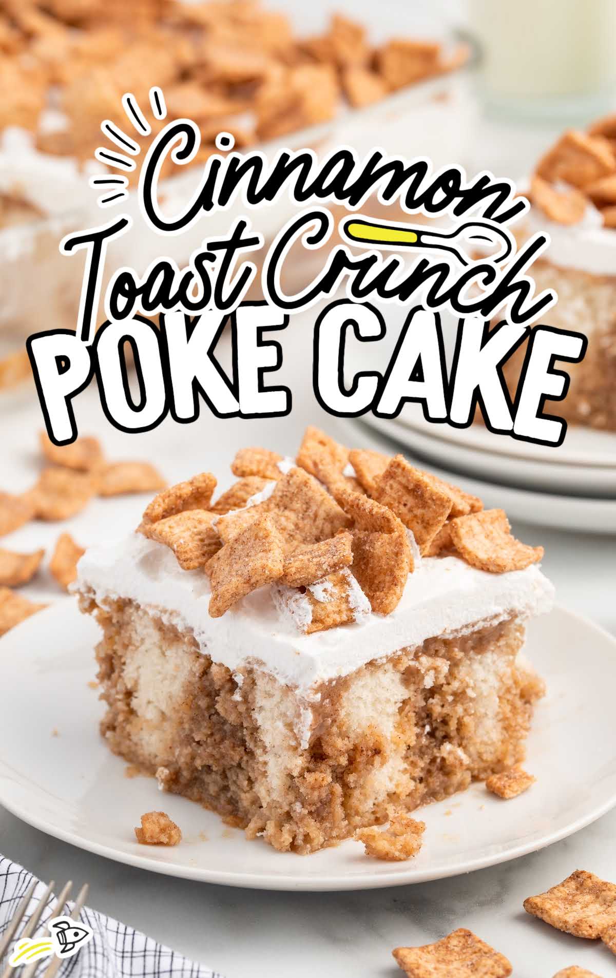 a slice of Cinnamon Toast Crunch Poke Cake on a plate