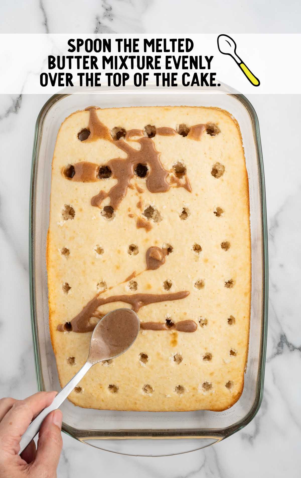 warm butter mixture spooned evenly over the top of the cake