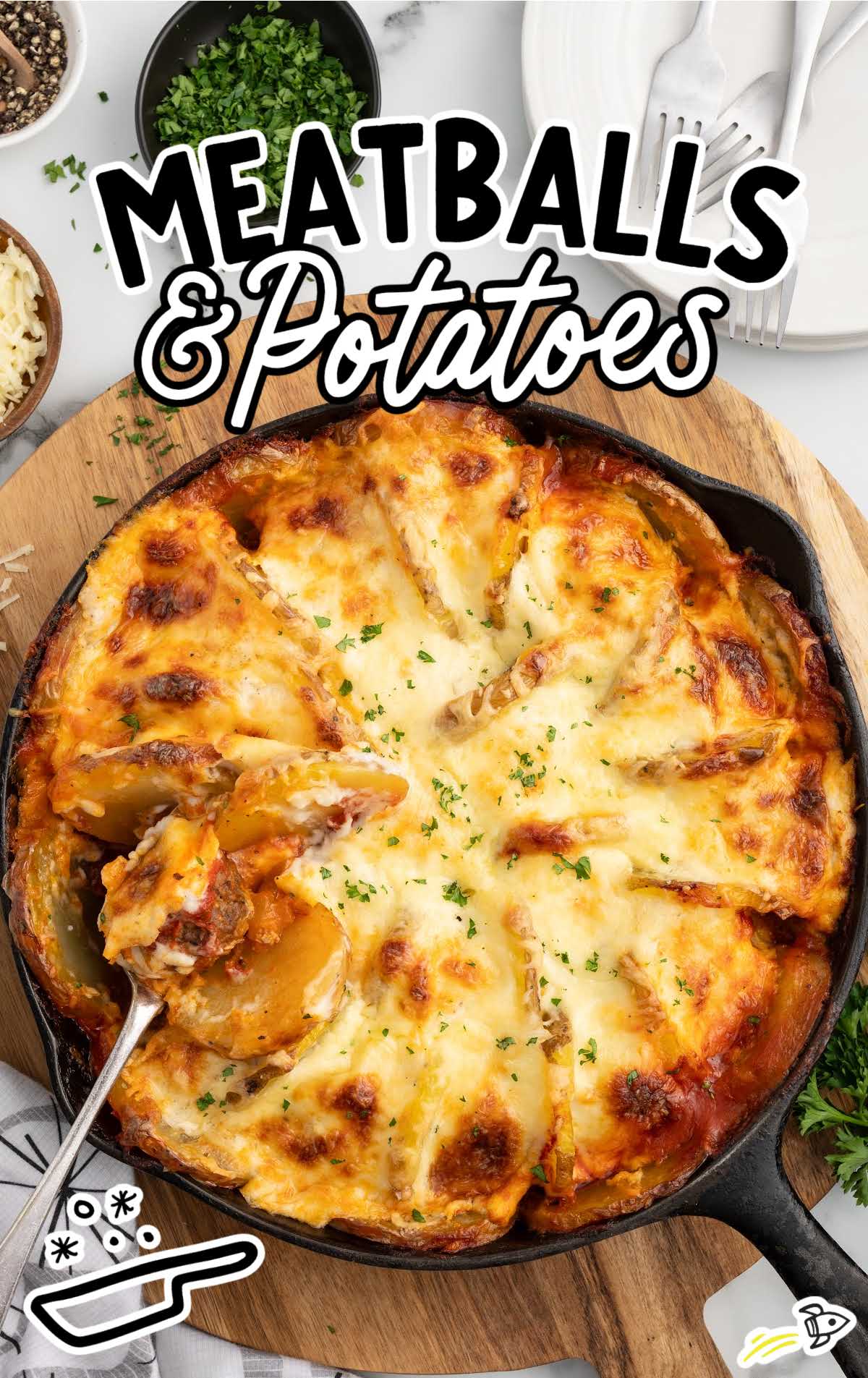 a skillet of Meatballs and Potatoes garnished with parsley