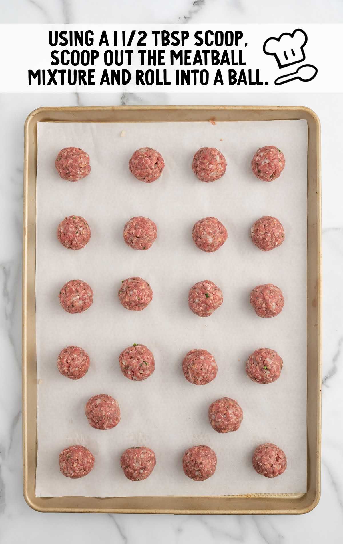 meatball mixture scooped into balls on the baking sheet