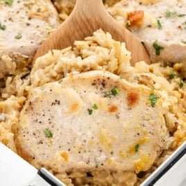 a baking dish of Pork Chop and Rice garnished with parsley