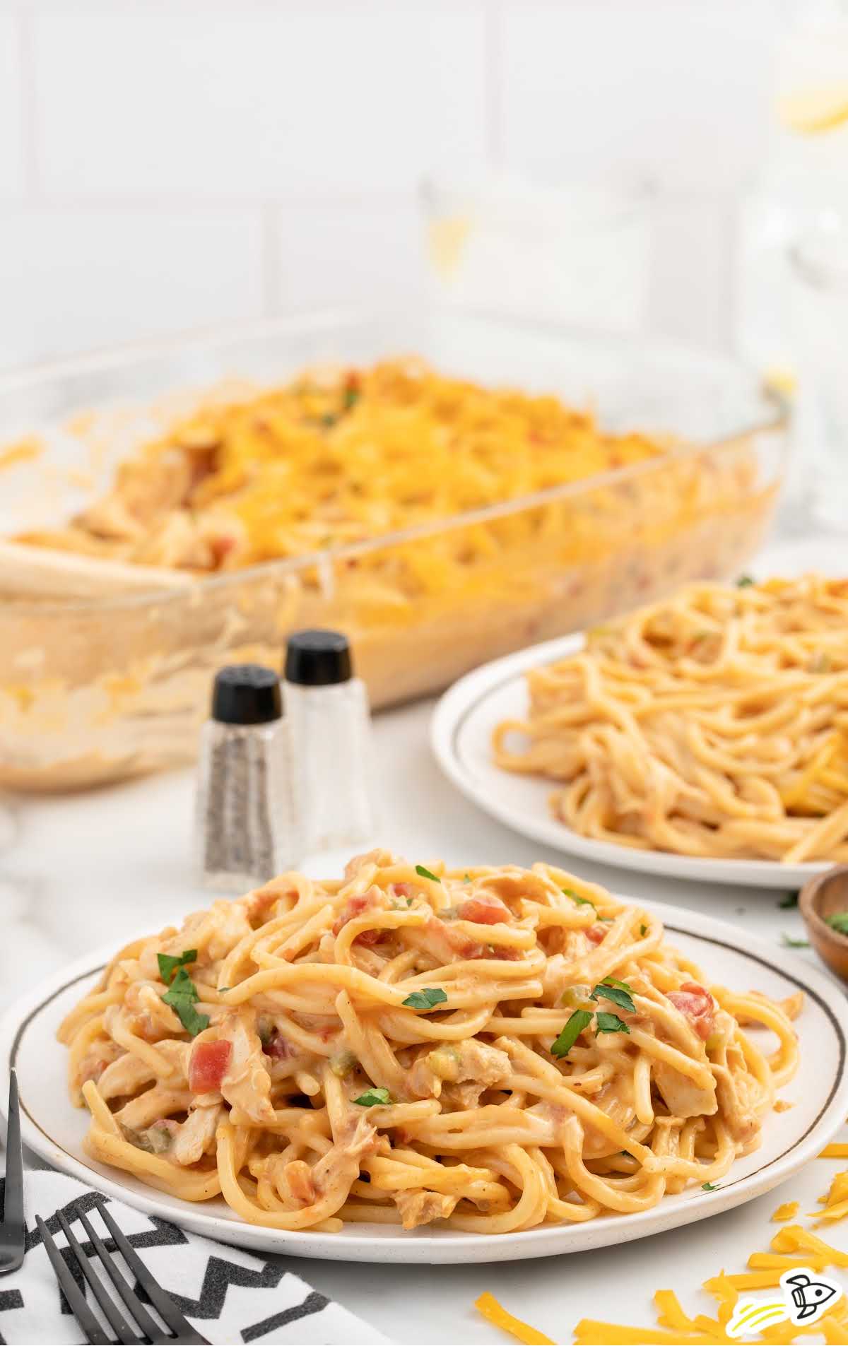 a plate of Chicken Spaghetti garnished with parsley