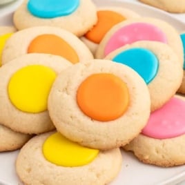 a plate of Thumbprint Cookies with colored icing