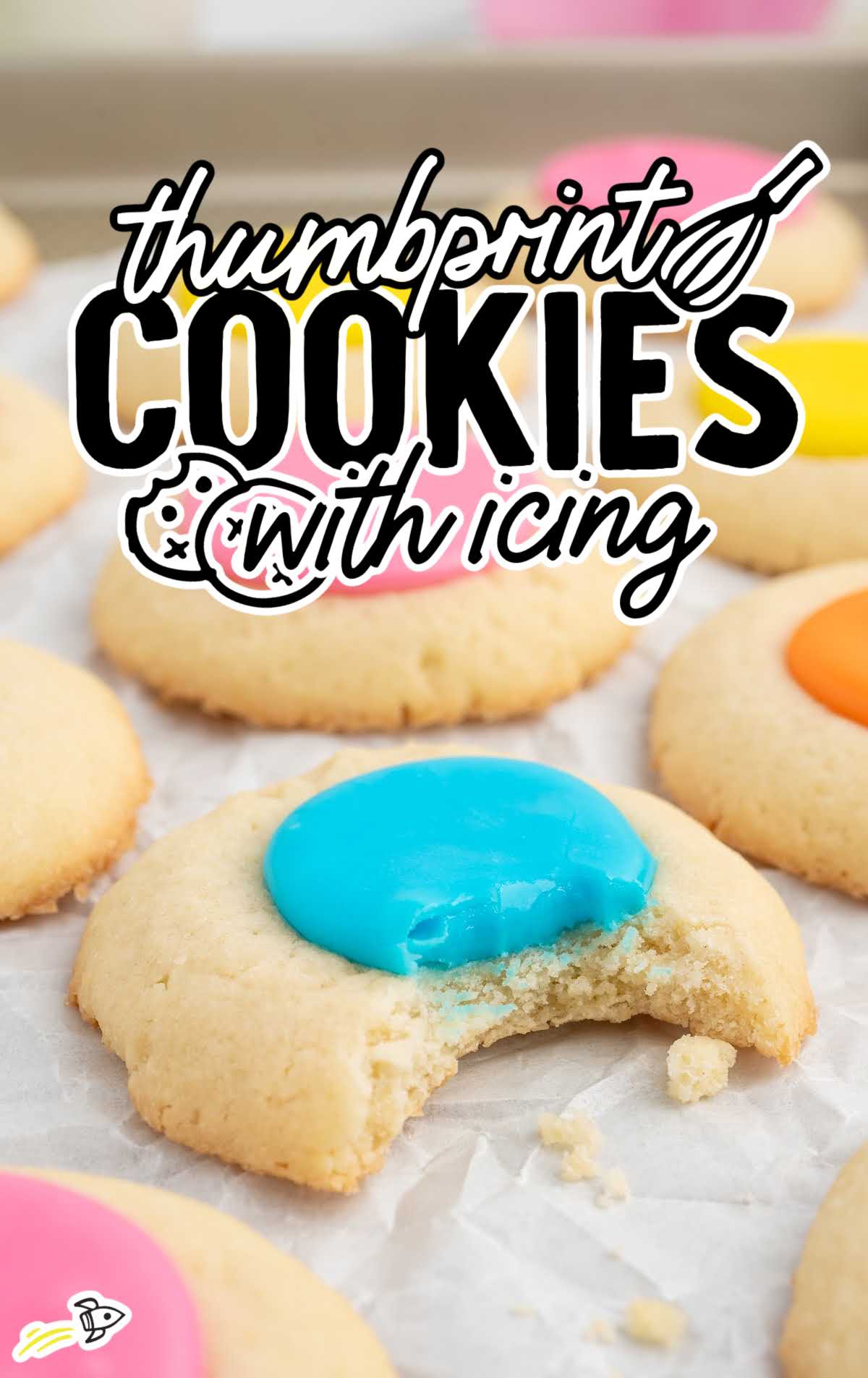 a bunch of Thumbprint Cookies with colored icing