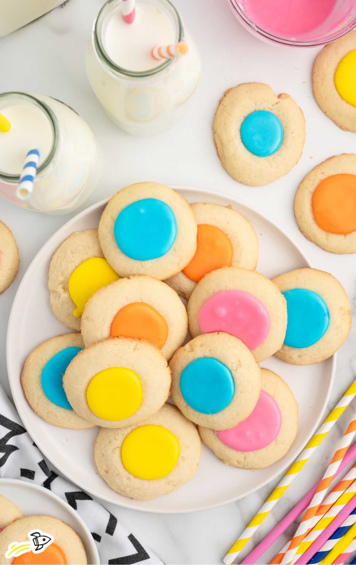 a plate of Thumbprint Cookies with colored icing