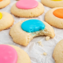 a bunch of Thumbprint Cookies with colored icing