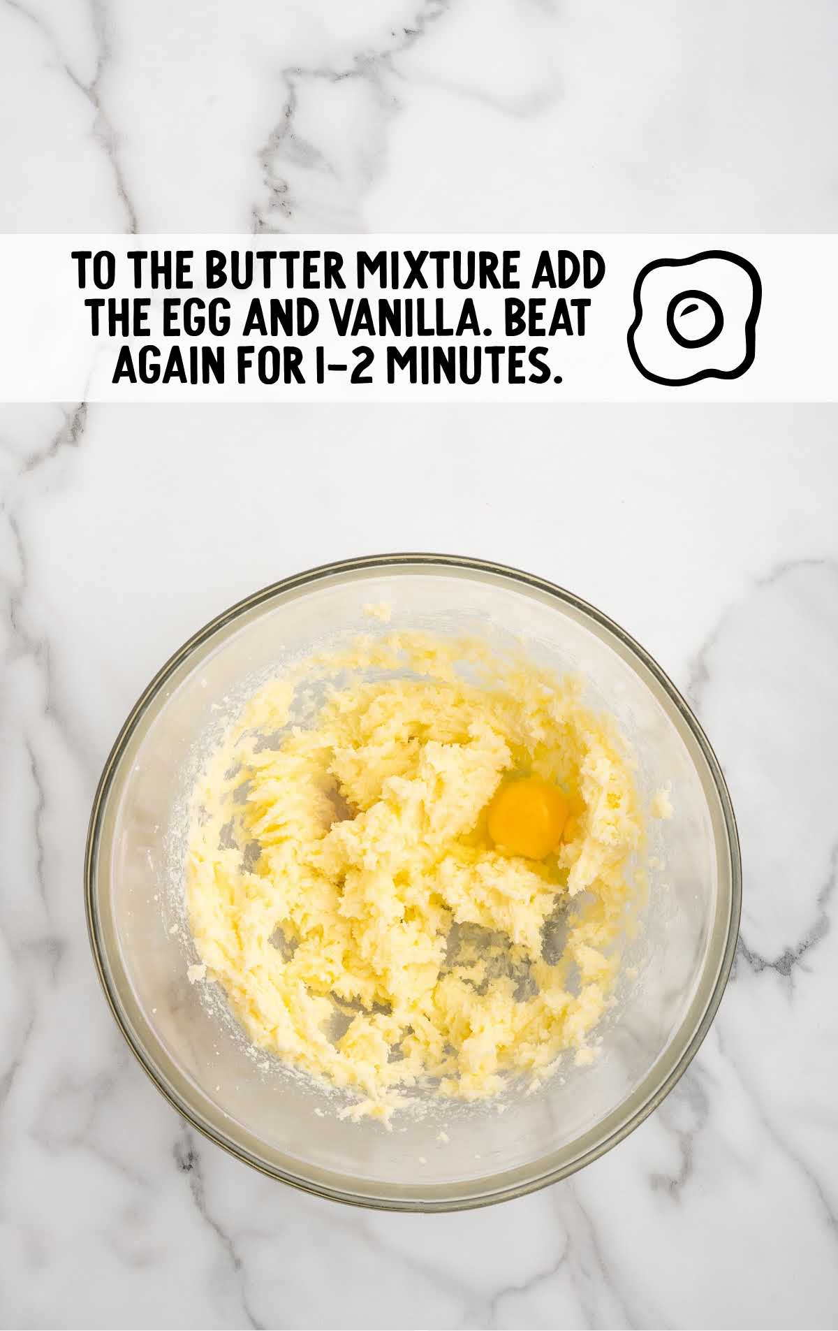 egg and the clear vanilla flavoring added to the butter mixture in the bowl