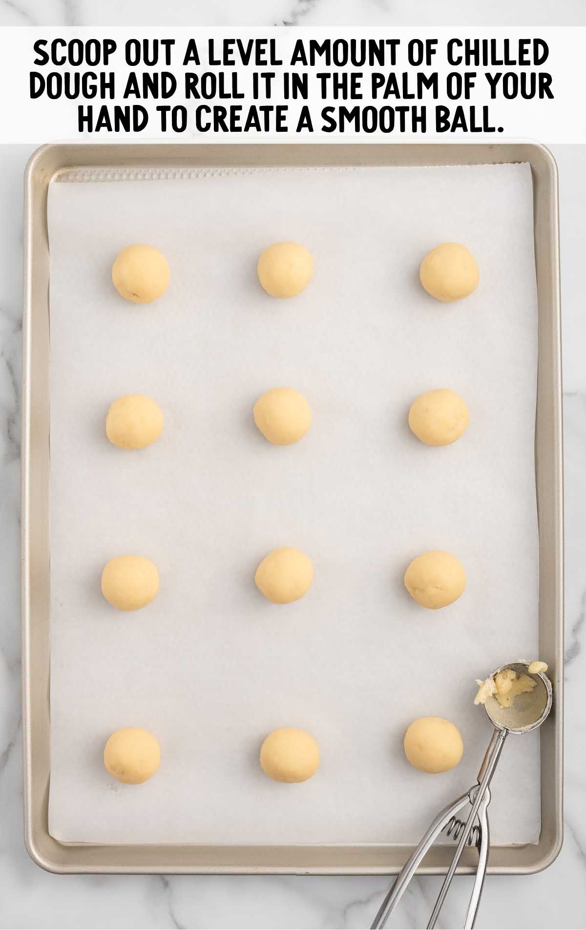 cookie dough balls scooped onto a baking sheet