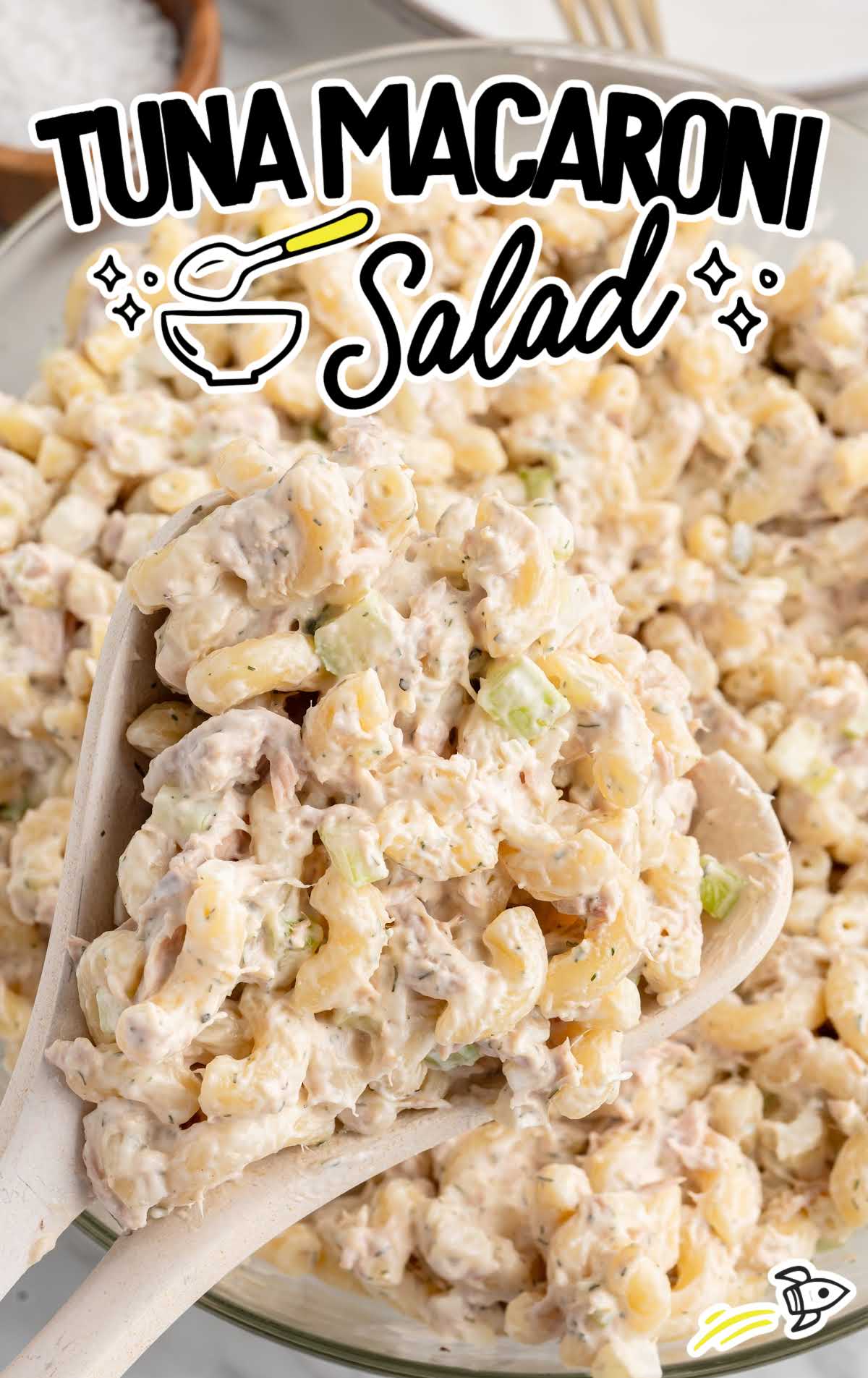 Large spoonful of classic tuna macaroni salad scooped from a serving bowl