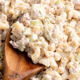 Overhead shot of tuna macaroni salad with creamy dressing and chopped vegetables