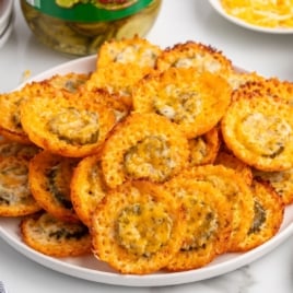 a bowl of fried pickles stack on top of each other