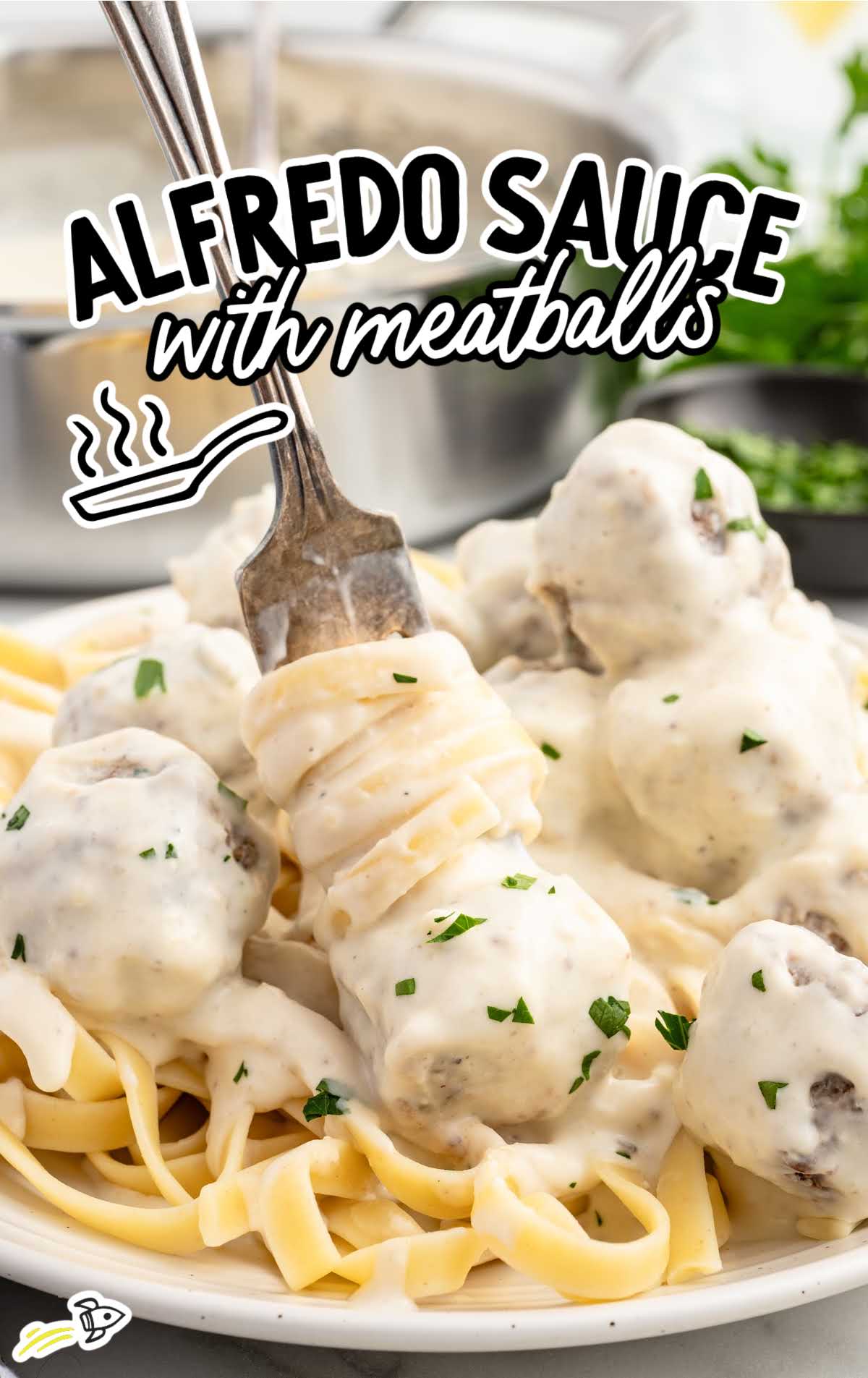 a plate of Alfredo Sauce with Meatballs served over pasta and garnished with parsley