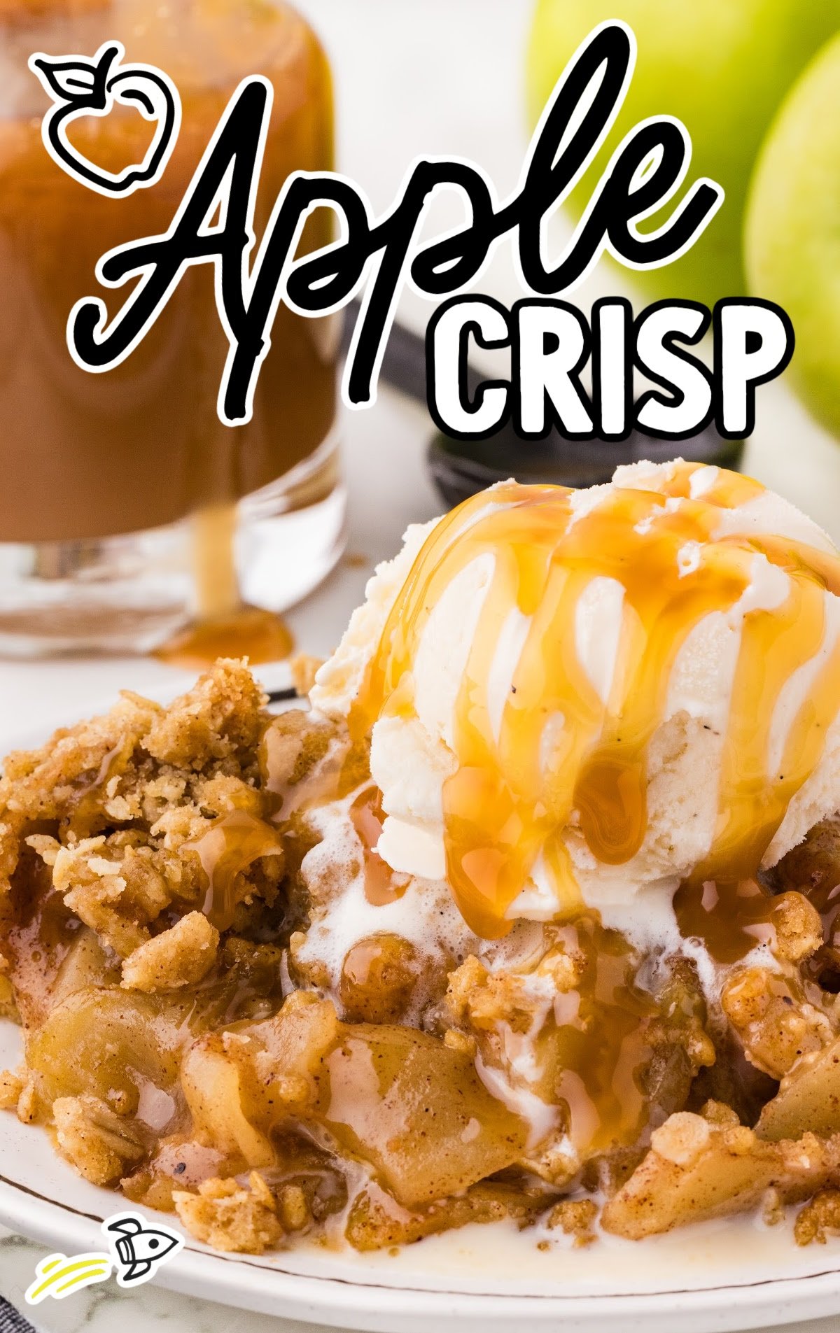 A plate of apple crisp with ice cream and caramel drizzle.