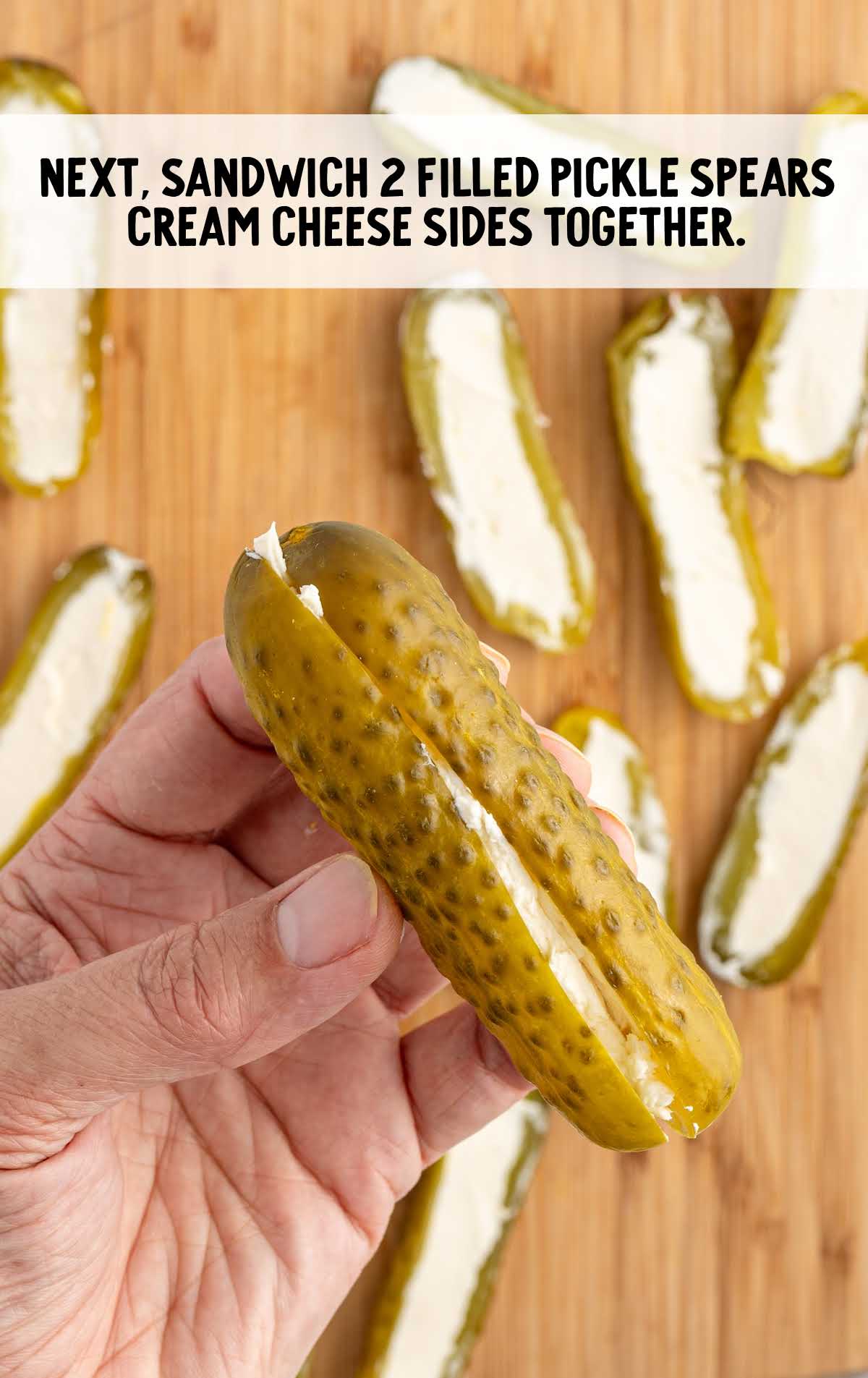 pickle spears filled with cream cheese smashed together