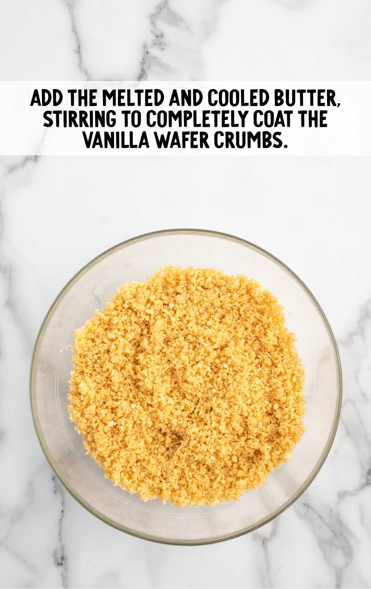 butter and vanilla wafer crumbs combined in a bowl